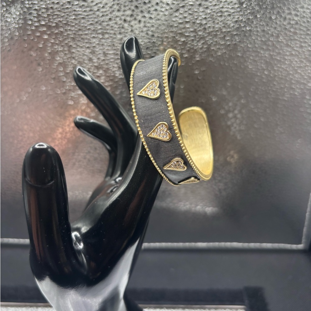 Gold and Black Heat Adjustable Bangles. 98.00 Each